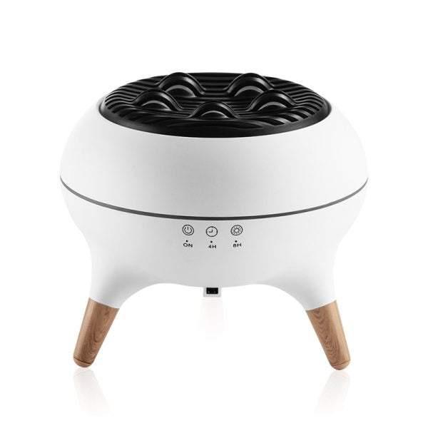 White and black cylindrical device with wooden legs on a white background